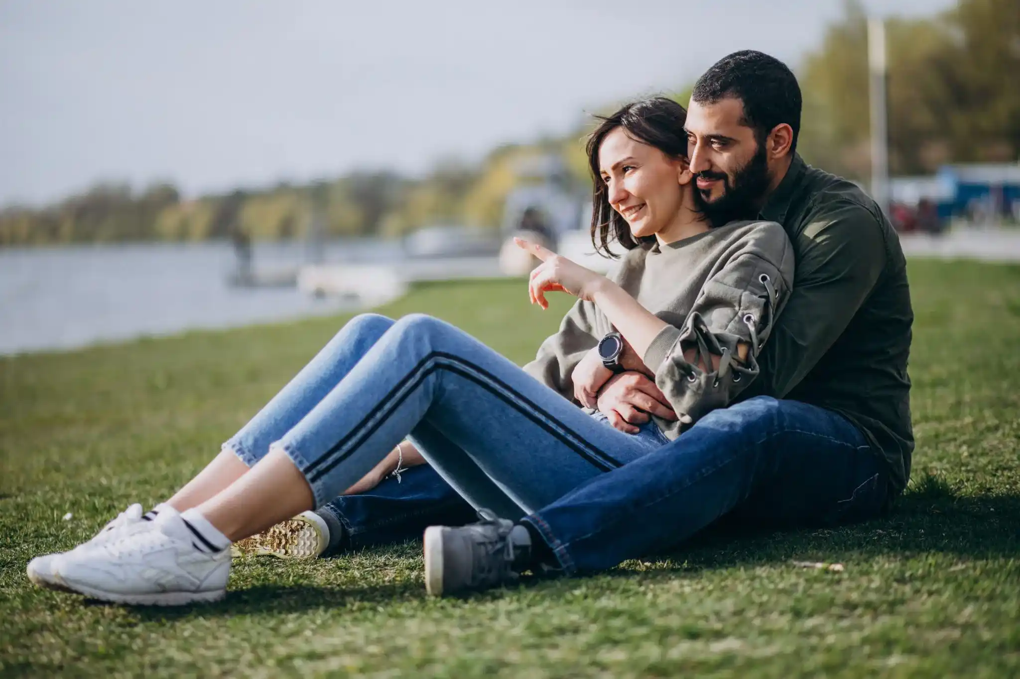 young international couple together park